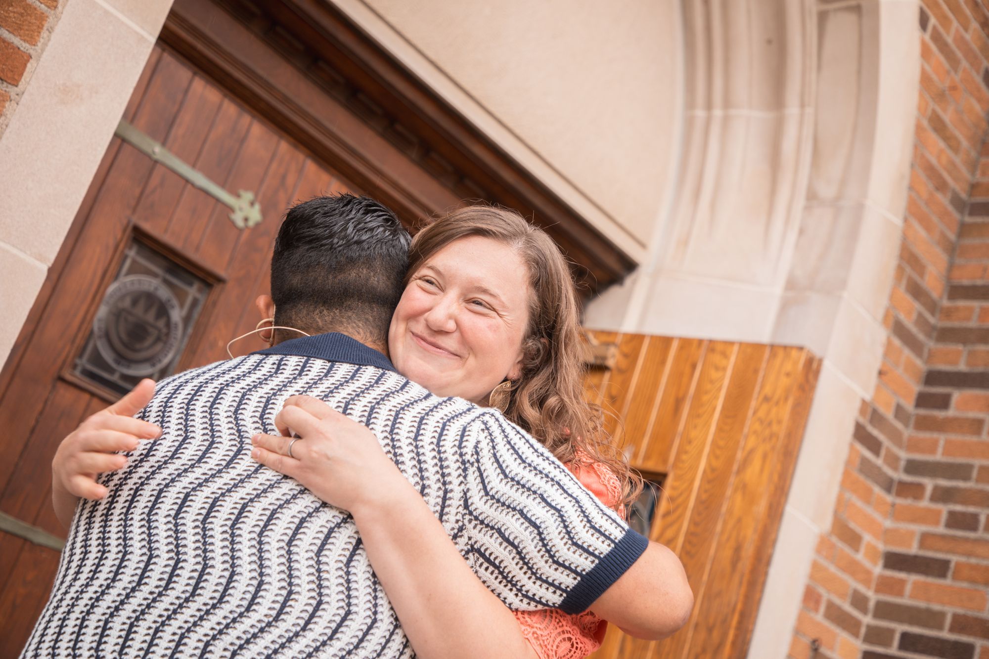 A welcome hug at the chapel doors