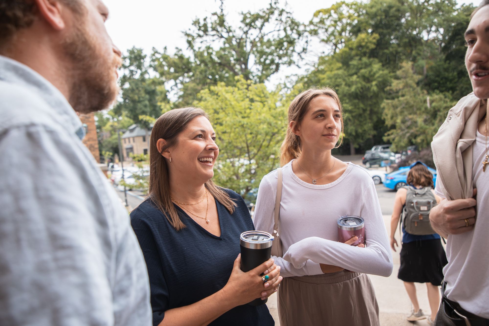 Friends talking outside chapel