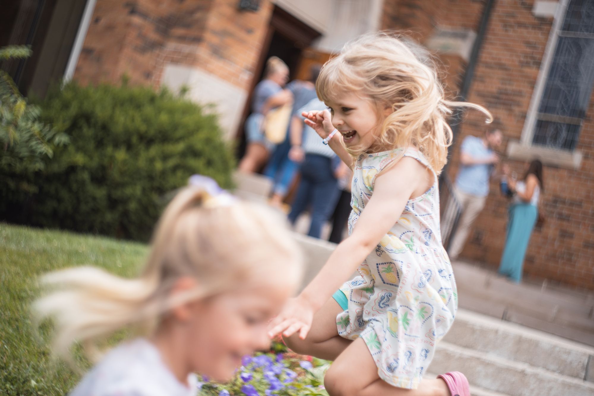 Kids playing outside the chapel
